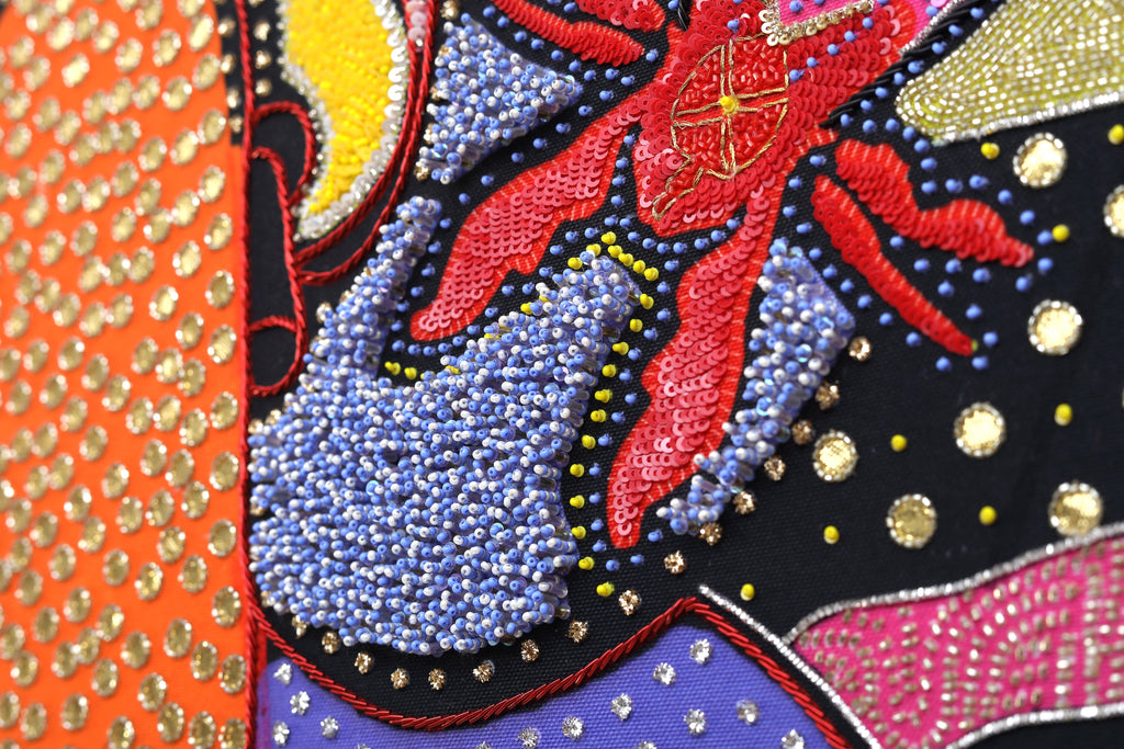 Sacred Offering (Black) detail: sequin and crystal work in yellow and vermilion