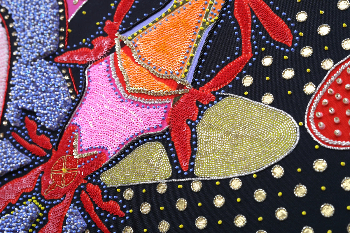 Sacred Offering (Black) detail: dense beadwork and crystal setting at close range