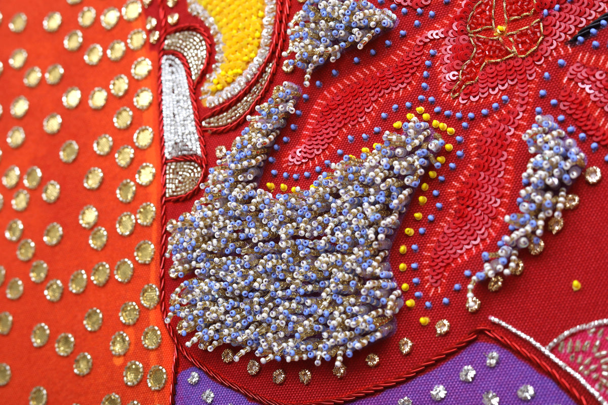 Sacred Offering (Maroon) detail: beaded trunk and crown on the maroon field