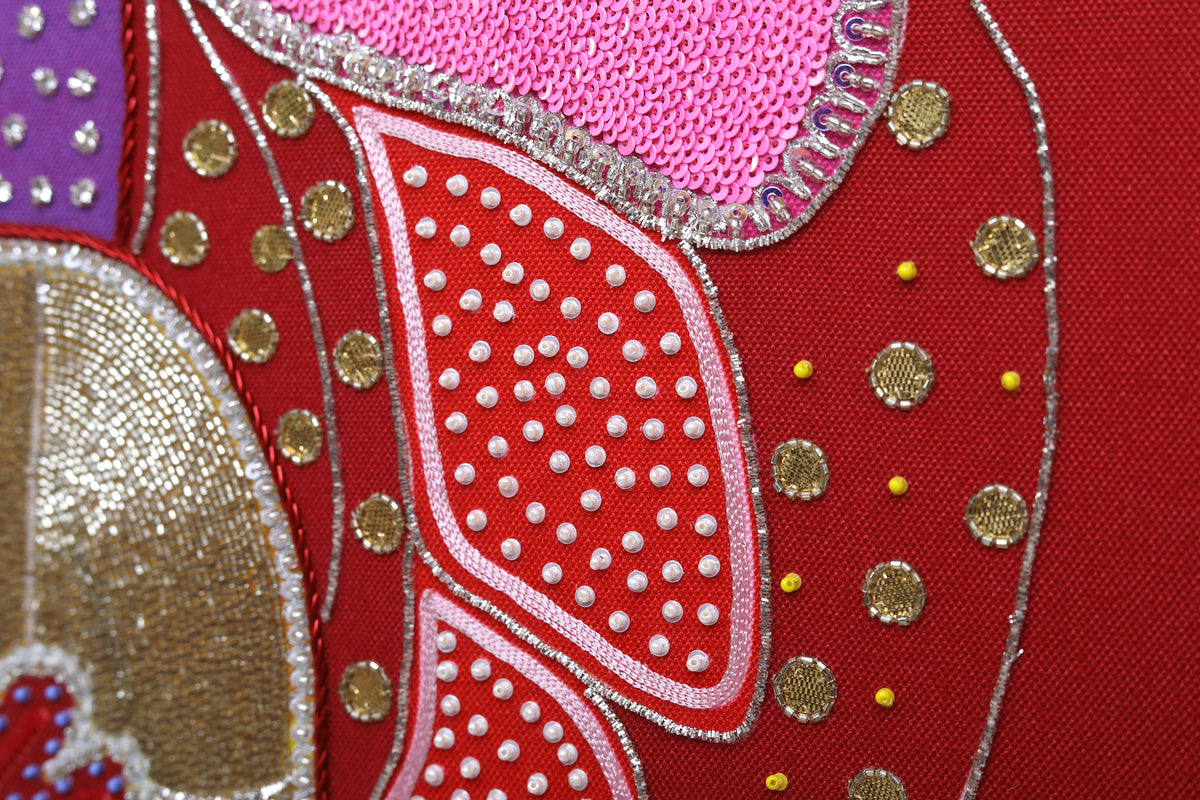 Sacred Offering (Maroon) detail: dense beadwork at close range