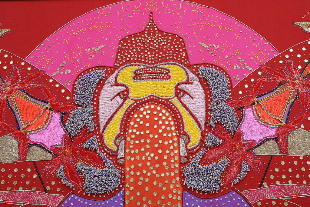 Sacred Offering (Maroon) detail: beadwork warming into the maroon ground