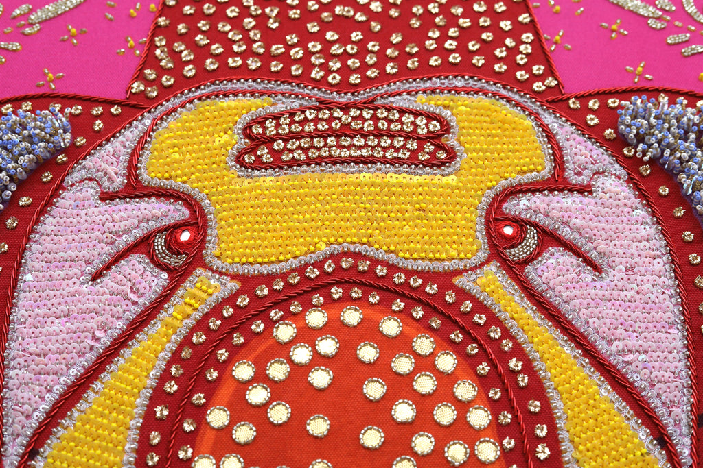 Sacred Offering (Maroon) detail: gold threadwork reading as glow against red